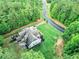Generous backyard and patio area with mature landscaping surrounding the property at 100 Chantilly Ln, Fayetteville, GA 30215