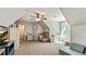 Bright, carpeted bedroom with a ceiling fan, sloped ceilings, and ample space for comfortable living at 100 Chantilly Ln, Fayetteville, GA 30215