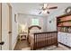 Comfortable bedroom featuring neutral tones, wood furniture, and a ceiling fan for added air circulation at 100 Chantilly Ln, Fayetteville, GA 30215