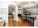 Open-concept dining room with hardwood floors, chandelier, and view to Gathering room at 100 Chantilly Ln, Fayetteville, GA 30215