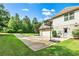 Home exterior featuring a large driveway with basketball hoop, grassy yard, and two-car garage at 100 Chantilly Ln, Fayetteville, GA 30215