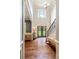 Spacious foyer with hardwood floors, staircase, and natural light creates an inviting entry at 100 Chantilly Ln, Fayetteville, GA 30215