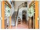 Elegant foyer with hardwood floors, staircase, and open view to living spaces at 100 Chantilly Ln, Fayetteville, GA 30215