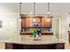 Modern kitchen with granite countertops, stainless steel appliances, and a central island with sink at 100 Chantilly Ln, Fayetteville, GA 30215
