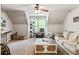 Cozy living room with neutral tones, a ceiling fan, and a decorative coffee table and comfortable seating at 100 Chantilly Ln, Fayetteville, GA 30215