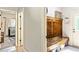 Mud room featuring an antique bench and storage cabinet and an exit door to the exterior at 100 Chantilly Ln, Fayetteville, GA 30215