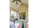 Relaxing screened porch featuring comfortable seating and an inviting atmosphere with pleasant views of greenery at 100 Chantilly Ln, Fayetteville, GA 30215