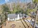 An aerial view of a charming one-story home with a dark roof, light siding, and a well-manicured lawn at 1571 Boulevard Lorraine Sw, Atlanta, GA 30311
