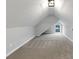 Attic area features neutral carpet, white walls, sloped ceilings and a window at 1571 Boulevard Lorraine Sw, Atlanta, GA 30311