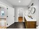 Bathroom with hardwood floors, dual vanities, modern mirrors and lighting at 1571 Boulevard Lorraine Sw, Atlanta, GA 30311