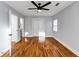 Neutral bedroom with pristine walls, hardwood floors, modern ceiling fan, and ample closet space for an airy feel at 1571 Boulevard Lorraine Sw, Atlanta, GA 30311