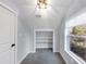 Bedroom with a storage closet, white trim, and a window with natural light at 1571 Boulevard Lorraine Sw, Atlanta, GA 30311
