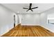 Bright bedroom featuring hardwood floors, a ceiling fan, and modern fixtures at 1571 Boulevard Lorraine Sw, Atlanta, GA 30311