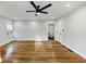 Bedroom with hardwood floors, ceiling fan, recessed lights and attached bathroom at 1571 Boulevard Lorraine Sw, Atlanta, GA 30311