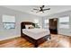 Cozy bedroom featuring hardwood floors, ensuite bath and closet with natural light at 1571 Boulevard Lorraine Sw, Atlanta, GA 30311