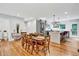 Spacious dining room and kitchen area featuring stainless steel appliances and hardwood flooring at 1571 Boulevard Lorraine Sw, Atlanta, GA 30311
