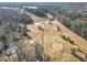 Aerial view of a golf course with dormant grass, covered greens, bare trees and a cart path at 1571 Boulevard Lorraine Sw, Atlanta, GA 30311