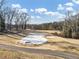 Aerial view of a golf course with dormant grass, covered greens, and bare trees at 1571 Boulevard Lorraine Sw, Atlanta, GA 30311