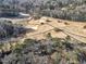 Aerial view of a golf course with dormant grass, covered greens, and bare trees at 1571 Boulevard Lorraine Sw, Atlanta, GA 30311