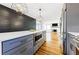 Kitchen featuring built-in microwave in island, stainless steel refrigerator, and an open design to the living area at 1571 Boulevard Lorraine Sw, Atlanta, GA 30311
