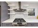 Gourmet kitchen with stainless steel appliances, open shelving, and stylish subway tile backsplash for a contemporary feel at 1571 Boulevard Lorraine Sw, Atlanta, GA 30311