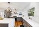 Bright kitchen showcases quartz countertops, stainless steel appliances, subway tile backsplash, and modern pendant lighting at 1571 Boulevard Lorraine Sw, Atlanta, GA 30311