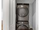Modern black stainless steel stacked washer and dryer at 1571 Boulevard Lorraine Sw, Atlanta, GA 30311
