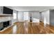 Bright living room featuring hardwood floors, neutral paint colors, and a brick fireplace at 1571 Boulevard Lorraine Sw, Atlanta, GA 30311