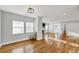 Spacious living room with hardwood floors, multiple windows, and an open floor plan perfect for entertaining at 1571 Boulevard Lorraine Sw, Atlanta, GA 30311