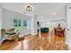Bright living room with hardwood floors, multiple windows, and open floor plan at 1571 Boulevard Lorraine Sw, Atlanta, GA 30311