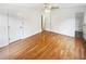 A bedroom featuring light hardwood floors, white walls, and neutral carpet in the doorway to the bathroom at 2325 Sebring Sw Ct, Marietta, GA 30064