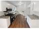 Updated kitchen with stainless steel appliances, granite countertops, and hardwood floors at 2325 Sebring Sw Ct, Marietta, GA 30064