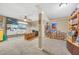 Spacious basement office area with a ceiling fan, neutral carpet, and plenty of shelving at 2505 Oakrill Rd, Marietta, GA 30062