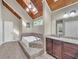 Bright bathroom with a skylight, stained glass window, and a large soaking tub at 2505 Oakrill Rd, Marietta, GA 30062