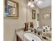 Bathroom featuring a granite countertop, dark fixtures, and a decorative mirror at 2505 Oakrill Rd, Marietta, GA 30062