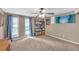 Bright bedroom featuring two large windows and a ceiling fan at 2505 Oakrill Rd, Marietta, GA 30062