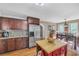 Spacious kitchen with stainless steel refrigerator, custom cabinets and eat in dining area at 2505 Oakrill Rd, Marietta, GA 30062