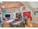 Comfortable living room with wood ceiling, hardwood floors, and a stone fireplace at 2505 Oakrill Rd, Marietta, GA 30062