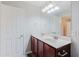 This bathroom features a double sink vanity, large mirror, and modern lighting fixtures at 3453 Dianthus Ln, Lawrenceville, GA 30044