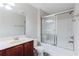 Bathroom with a tub and shower combination and sleek vanity with a light colored countertop at 3453 Dianthus Ln, Lawrenceville, GA 30044