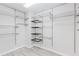 Walk-in closet featuring wire shelving and ample space for storage and organization at 3453 Dianthus Ln, Lawrenceville, GA 30044