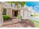 Attractive townhome showcasing a brick facade, a covered entrance, and a well-kept landscaped front yard at 3453 Dianthus Ln, Lawrenceville, GA 30044