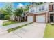Attractive townhome with a brick facade, a well-maintained lawn, and a two-car garage enhancing curb appeal at 3453 Dianthus Ln, Lawrenceville, GA 30044