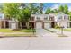 Charming townhome featuring a brick front, a well-manicured lawn, and a convenient two-car garage at 3453 Dianthus Ln, Lawrenceville, GA 30044