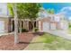 Lovely townhome featuring a brick and siding exterior, a well-kept lawn, and an attached two-car garage at 3453 Dianthus Ln, Lawrenceville, GA 30044