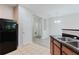 This kitchen features granite counters, wooden cabinets, and black appliances at 3453 Dianthus Ln, Lawrenceville, GA 30044