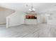 Open concept living space next to kitchen with hard surface floors and neutral paint at 3453 Dianthus Ln, Lawrenceville, GA 30044