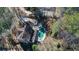 Aerial perspective of the property highlighting the pool, backyard, and mature tree coverage at 6300 Mountain Brook Ln, Atlanta, GA 30328