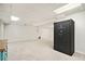 Unfinished basement with a carpet and a Liberty safe at 6300 Mountain Brook Ln, Atlanta, GA 30328