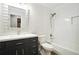 Remodeled bathroom with white subway tile, shower-tub, modern vanity, and updated fixtures at 6300 Mountain Brook Ln, Atlanta, GA 30328